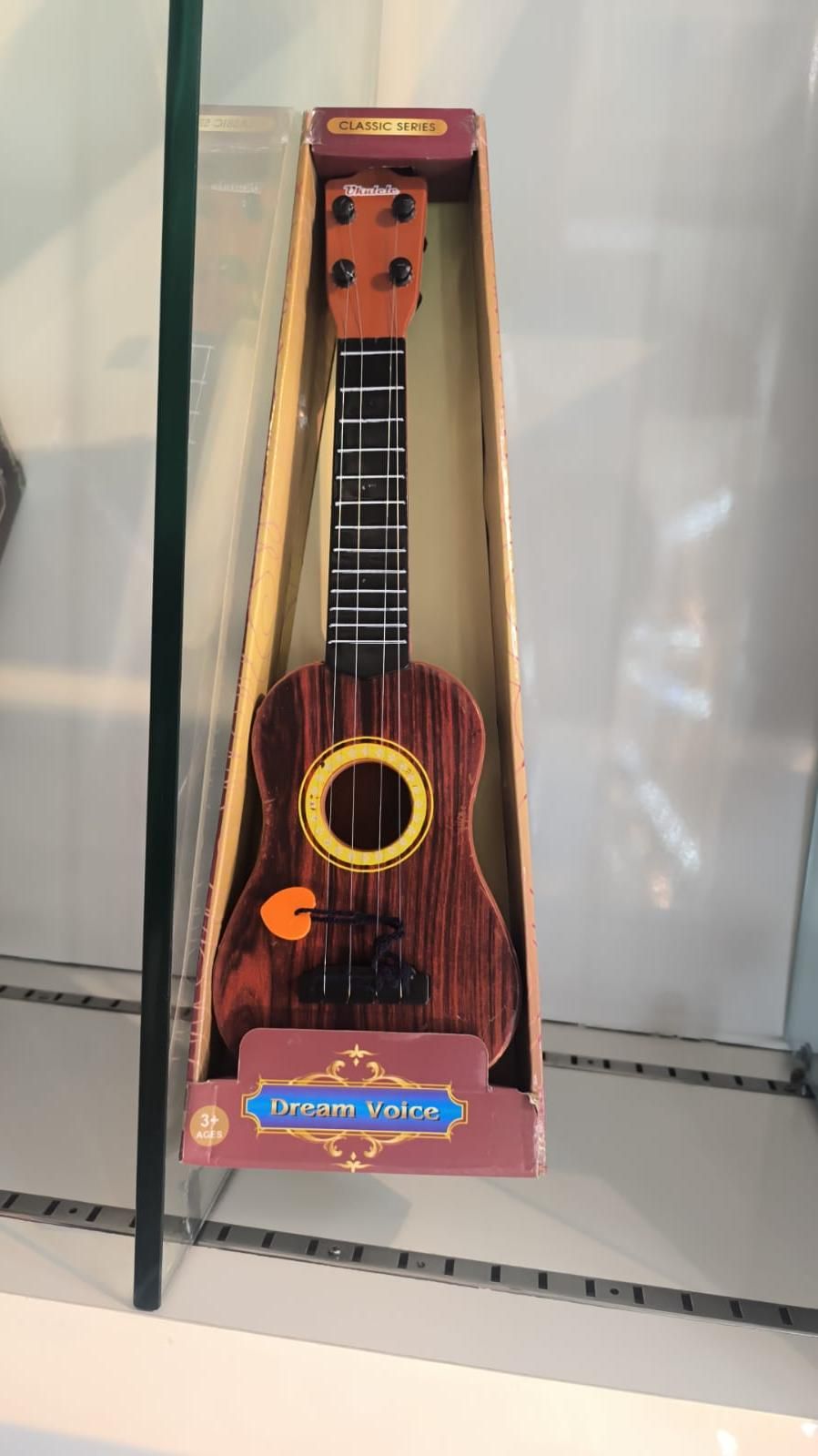 Mini Wooden Finish Plastic Guitar Music Instrument with 4 strings Clear sound - DOTSEL E COMMERCE
